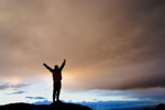 Open sky and figure with open arms